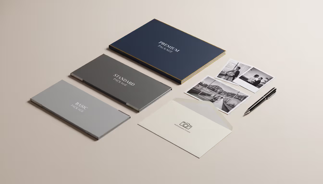 Three elegant service package brochures of different sizes on a minimalist desk with sample photos and a pen representing photography pricing tiers